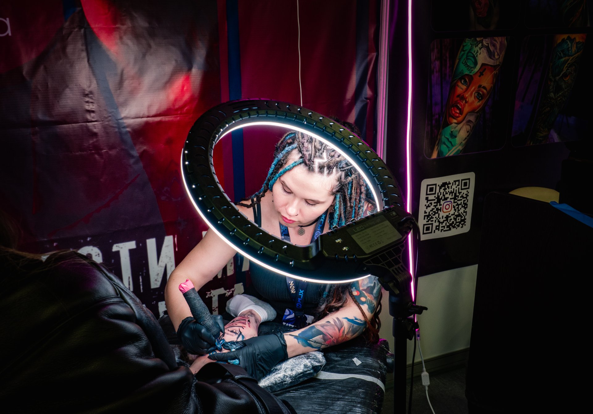 The process of tattooing. Some large and voluminous tattoos are done by masters for several months. This is a very difficult and time-consuming creative process.