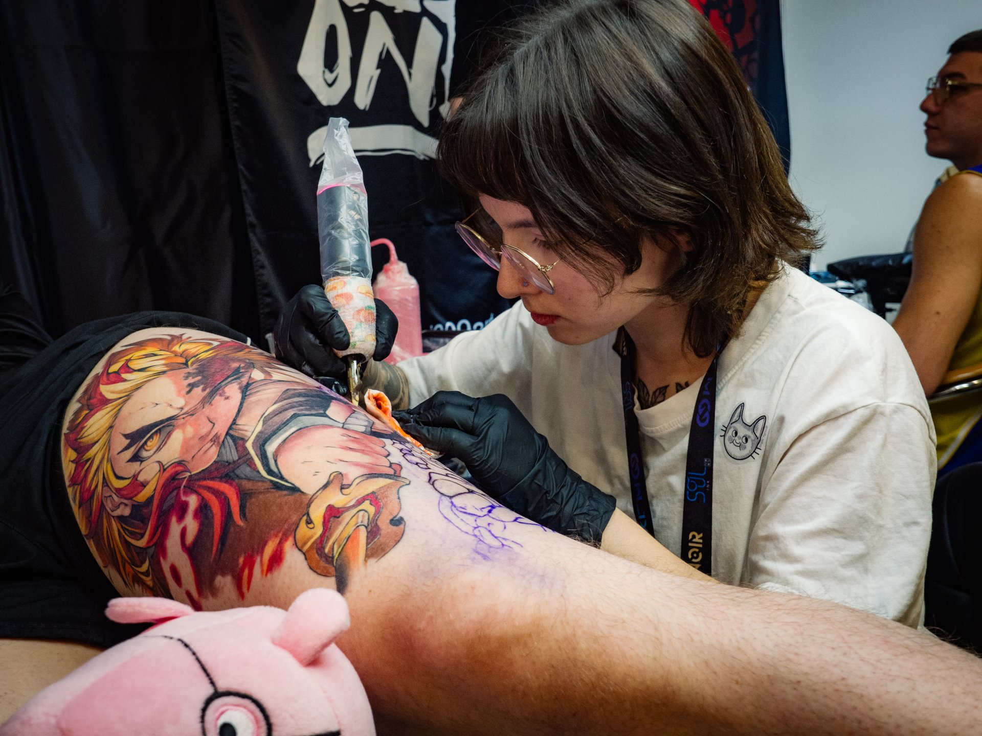 The process of tattooing. Some large and voluminous tattoos are done by masters for several months. This is a very difficult and time-consuming creative process.