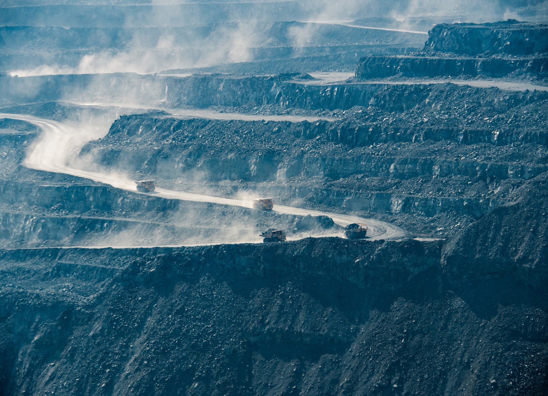 BelAZ vehicles deliver ore to processing plants.