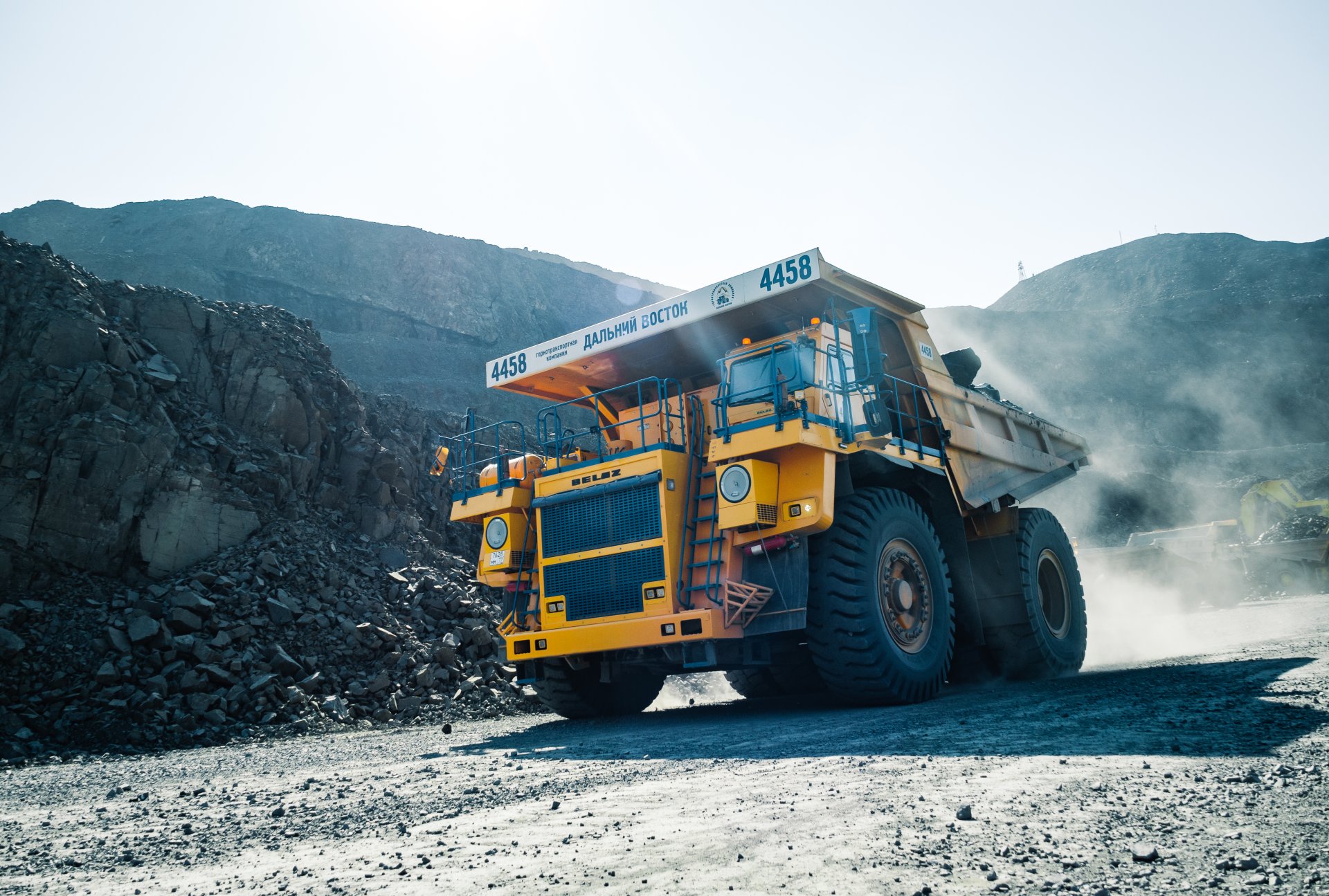 The diameter of the BelAZ wheel, which work here, is almost three meters. Only one of its tires weighs about 5 tons. The width of such a truck is almost 7 meters, the length is about 12 meters, and the height is 6 meters. Maximum power of 1875 hp.