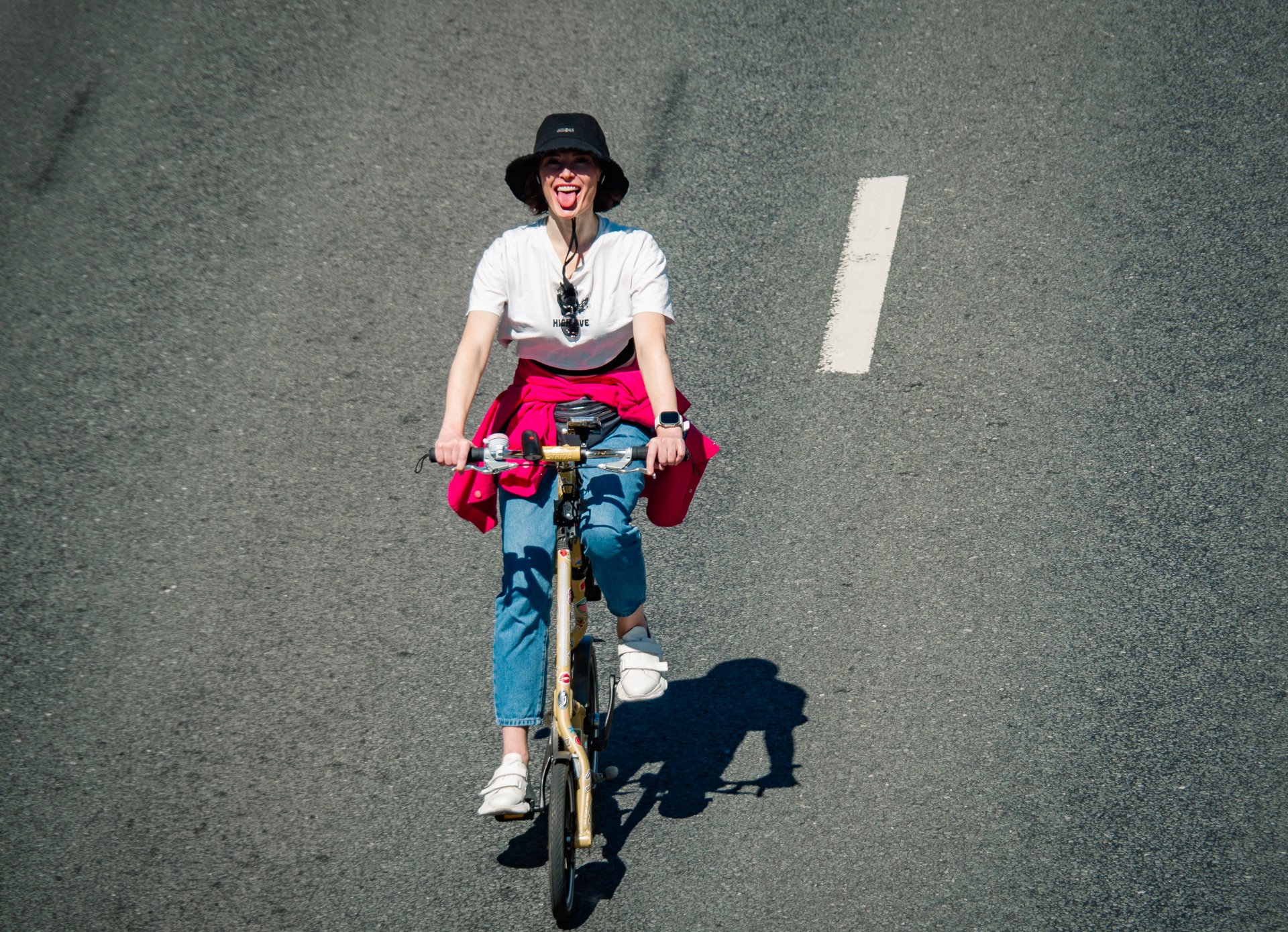 A girl on a bicycle riding along the Garden Ring.