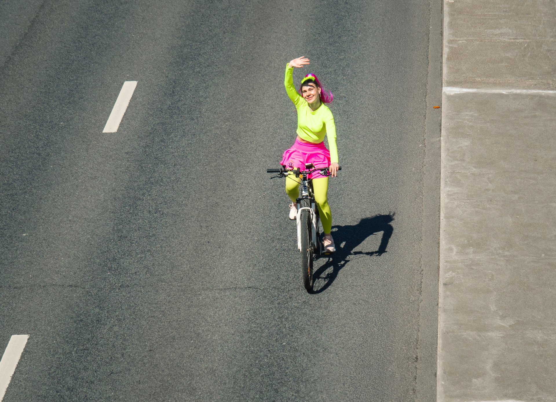 A girl greets photographers on the bridge.