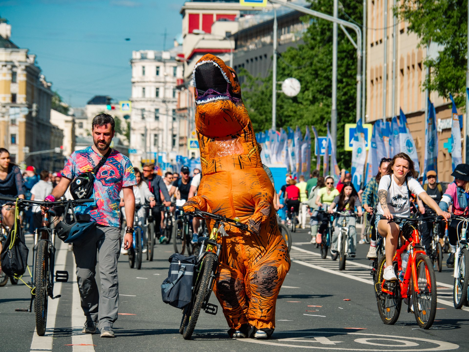 A man in a dinosaur costume.