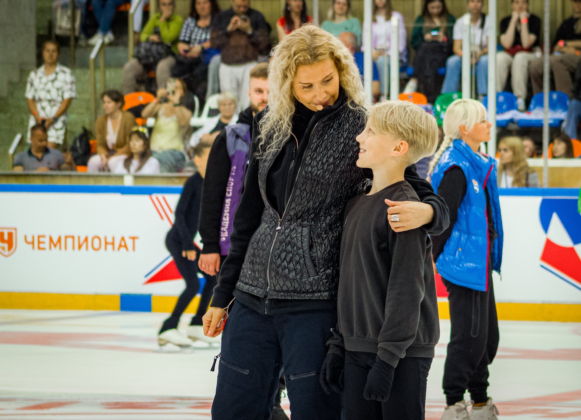 Eteri Tutberidze encourages a novice athlete.