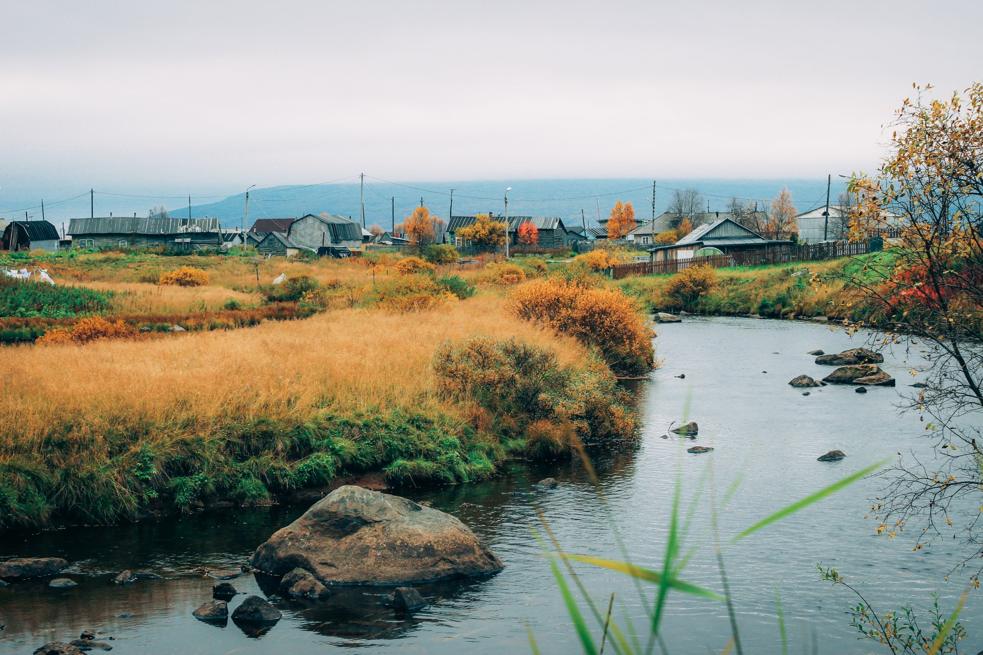 View of Lovozero village. Seydozero is surrounded by mountain ranges on three sides. The easiest way to get to it is to go there by boat from the village of Lovozero.