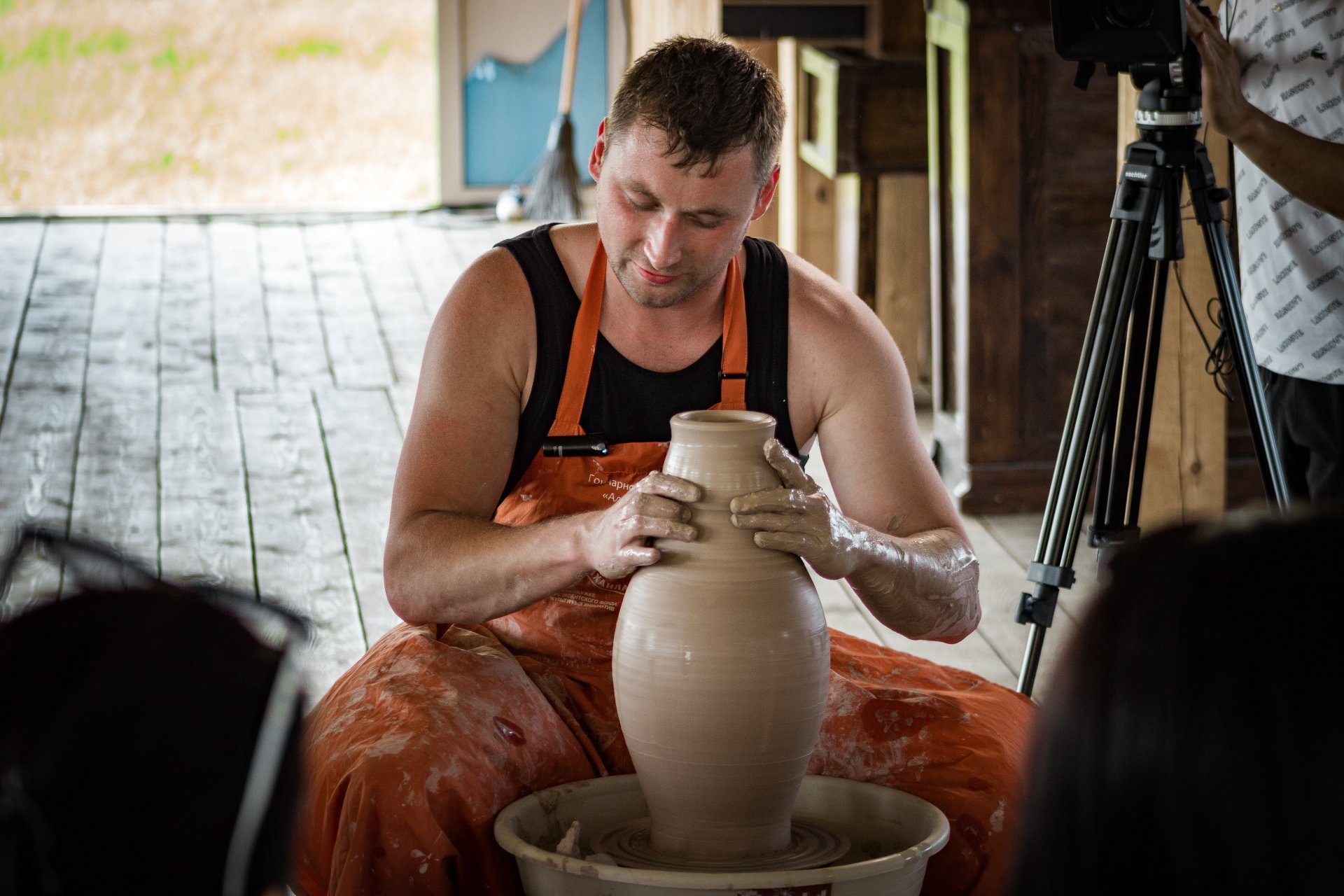 Mikhail teaching pottery.