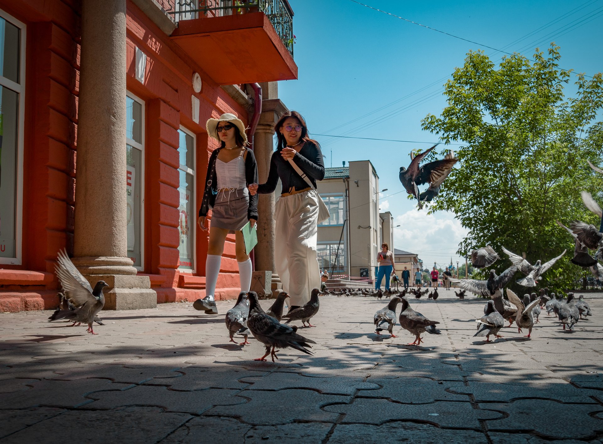 Girls stroll along the city's central pedestrian street.