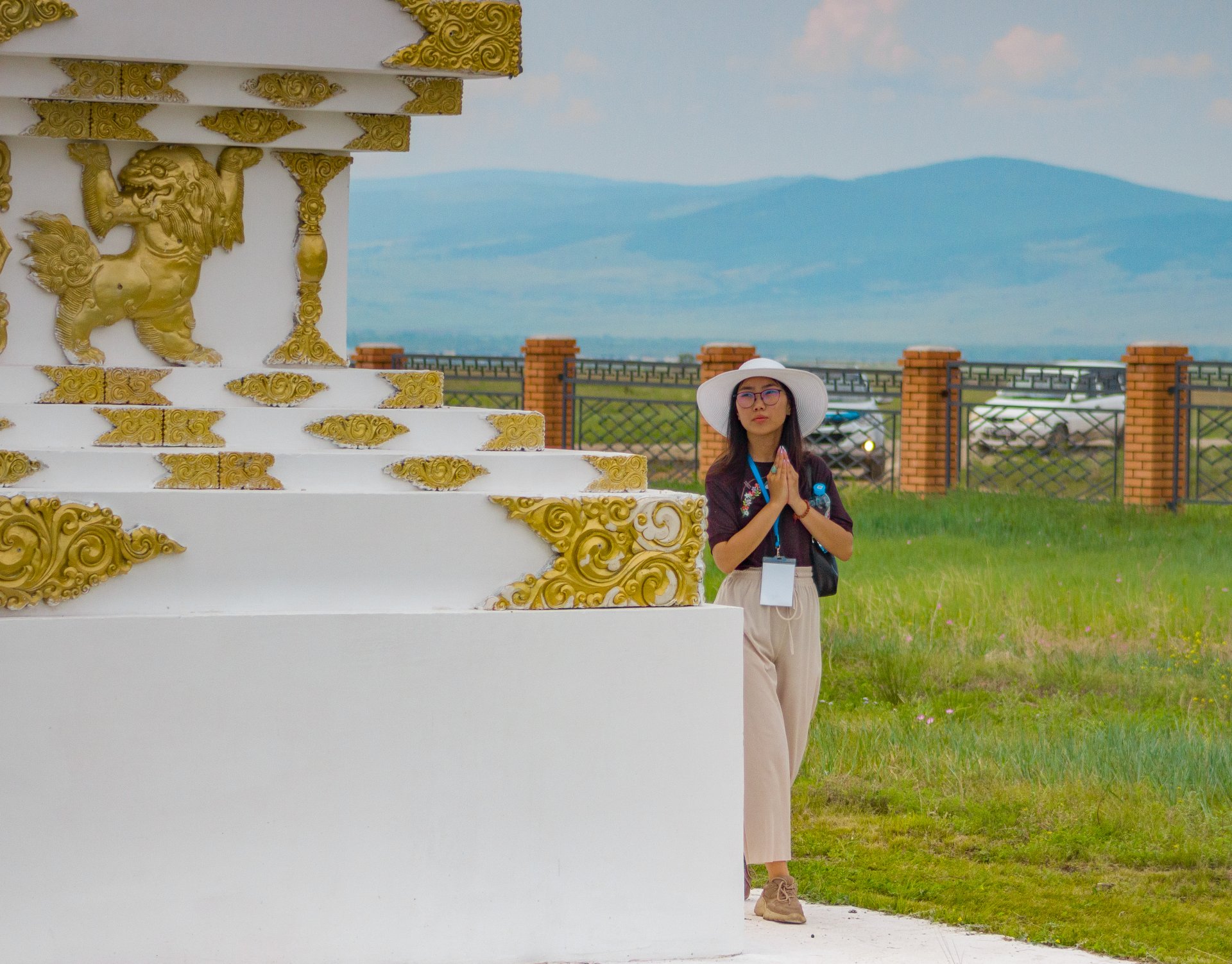 The parishioners of the datsan perform the sacred ritual of circumambulating the stupas.