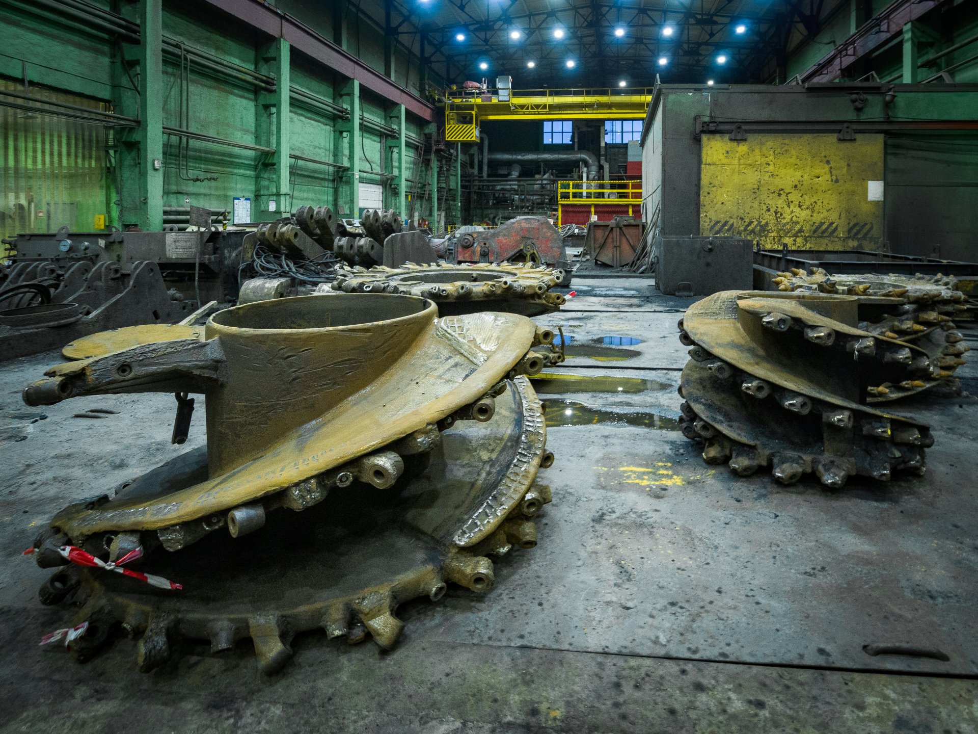 Parts of drilling rigs undergoing repairs.