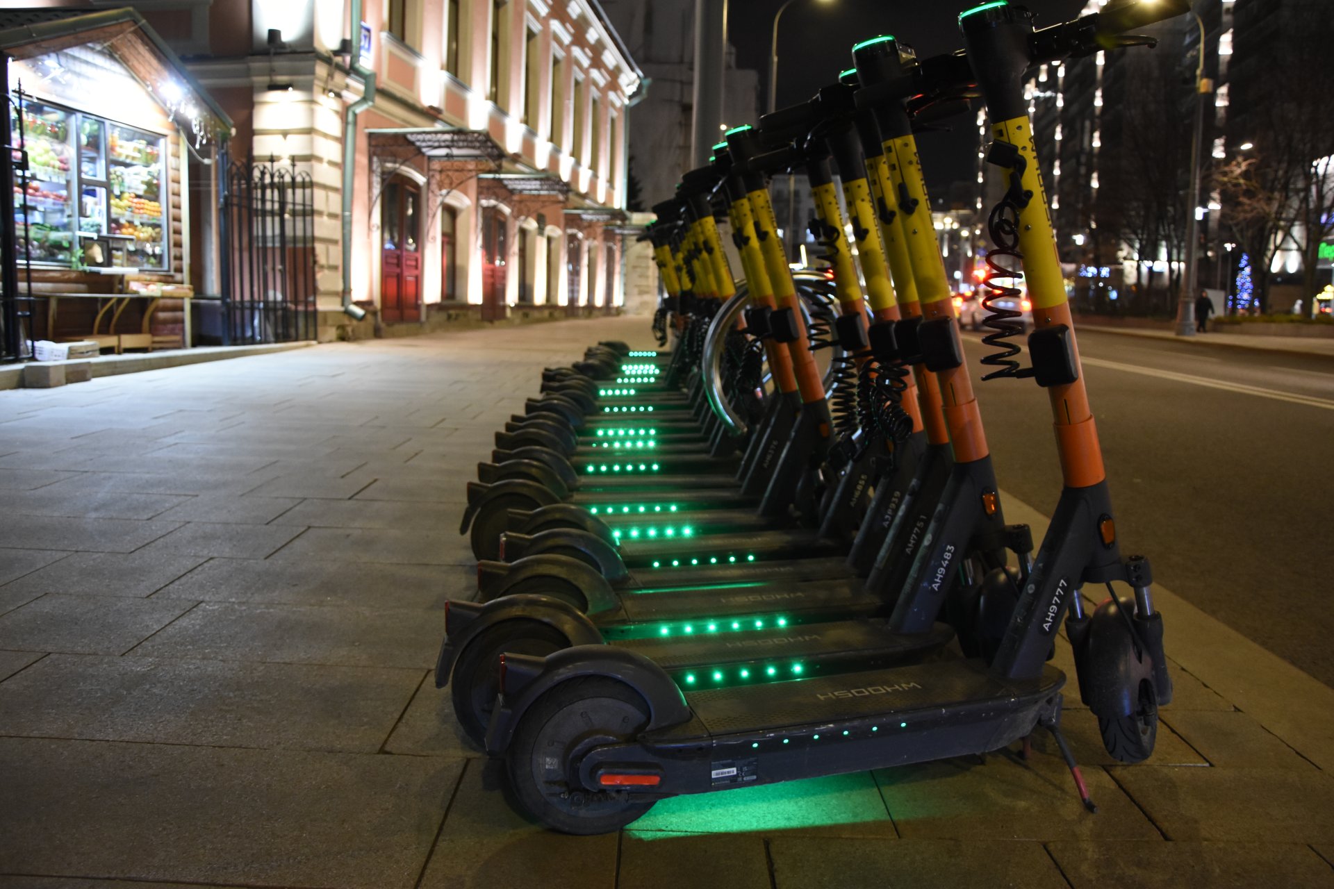 Electric scooters at night, Moscow, Bol'shaya Ordynka street, 2023.