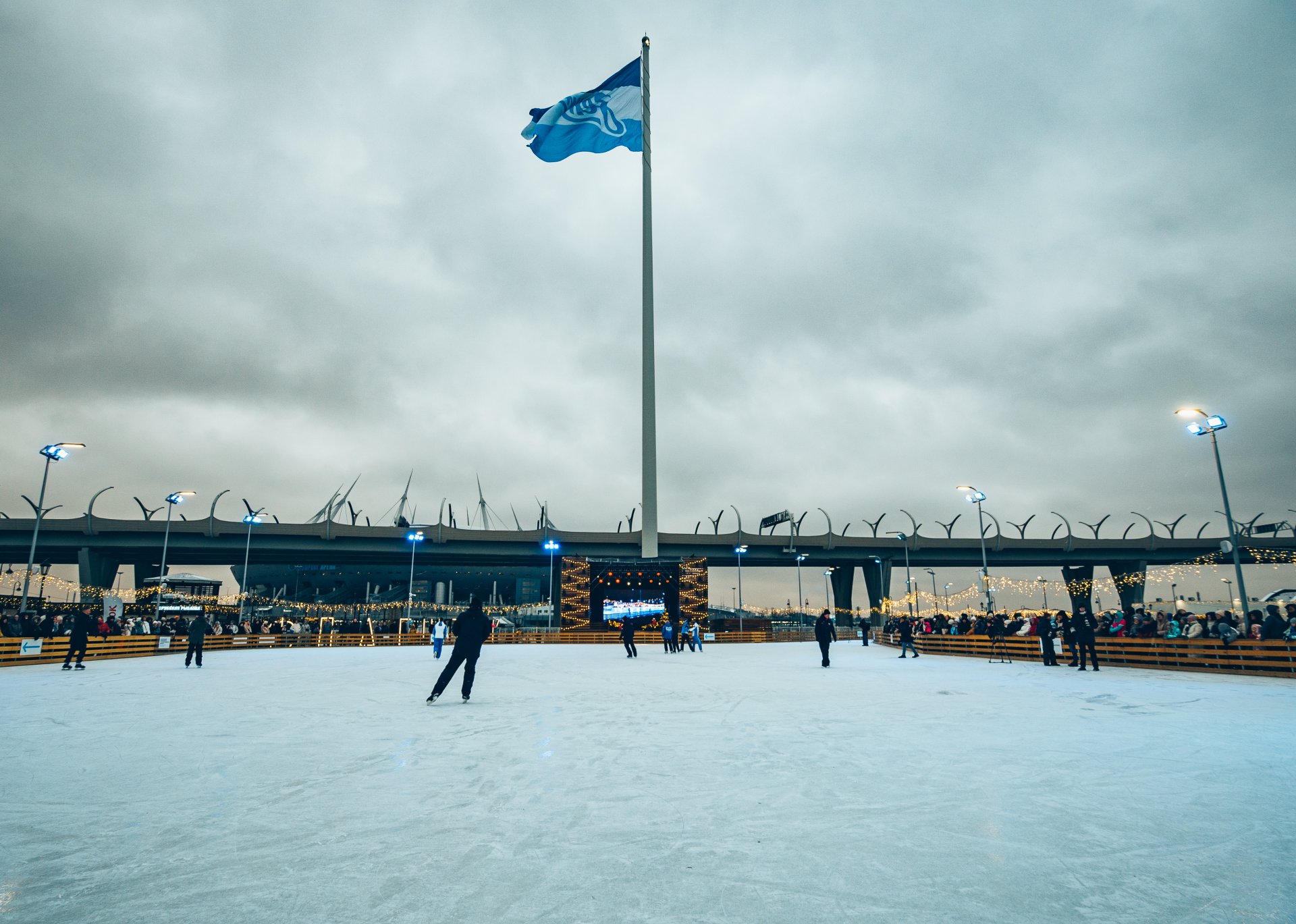 The flagpole on which the flag of the Zenit Football Club flies, the skating rink is located next to their home stadium, Gazprom Arena.