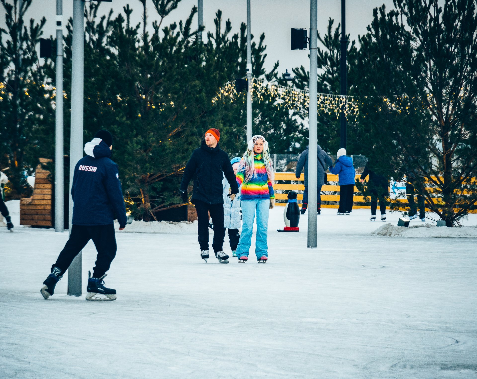 City residents and tourists come to appreciate the scale of the skating rink and have a good time.
