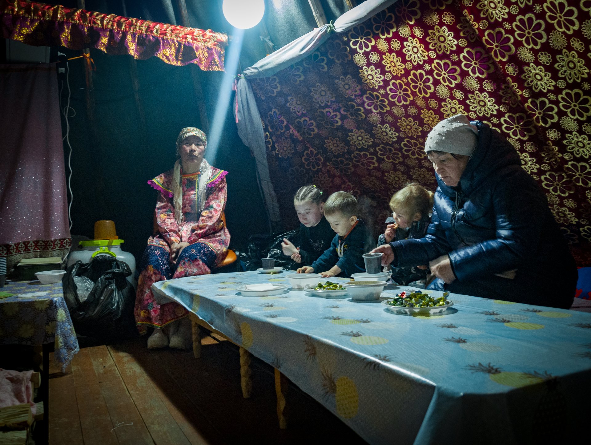 The stove is always lit inside the chum in winter. Traditionally, a woman is responsible for the comfort of the house.