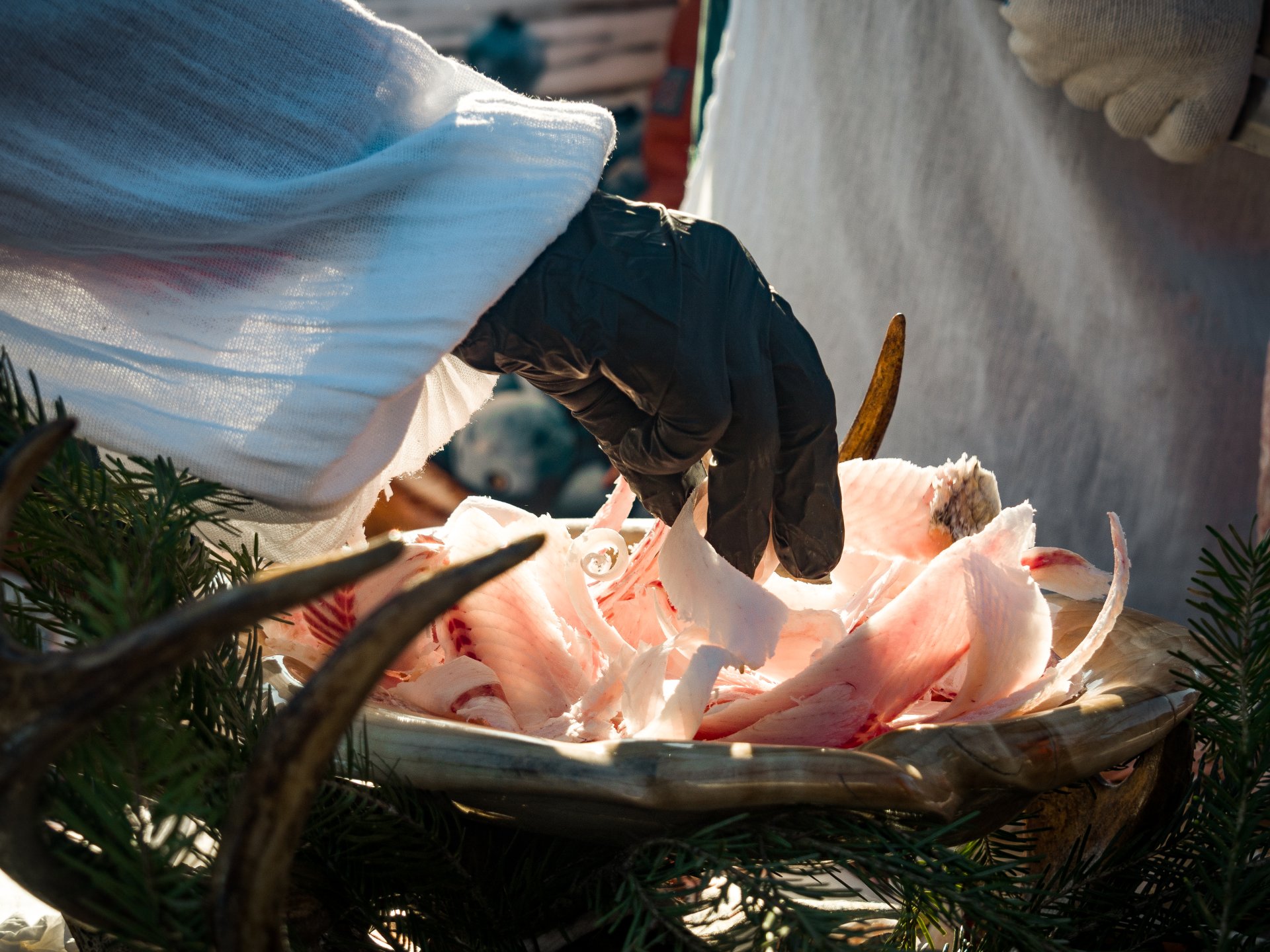 The winner of the competition is the one who slices the fish the thinnest and presents the dish beautifully.