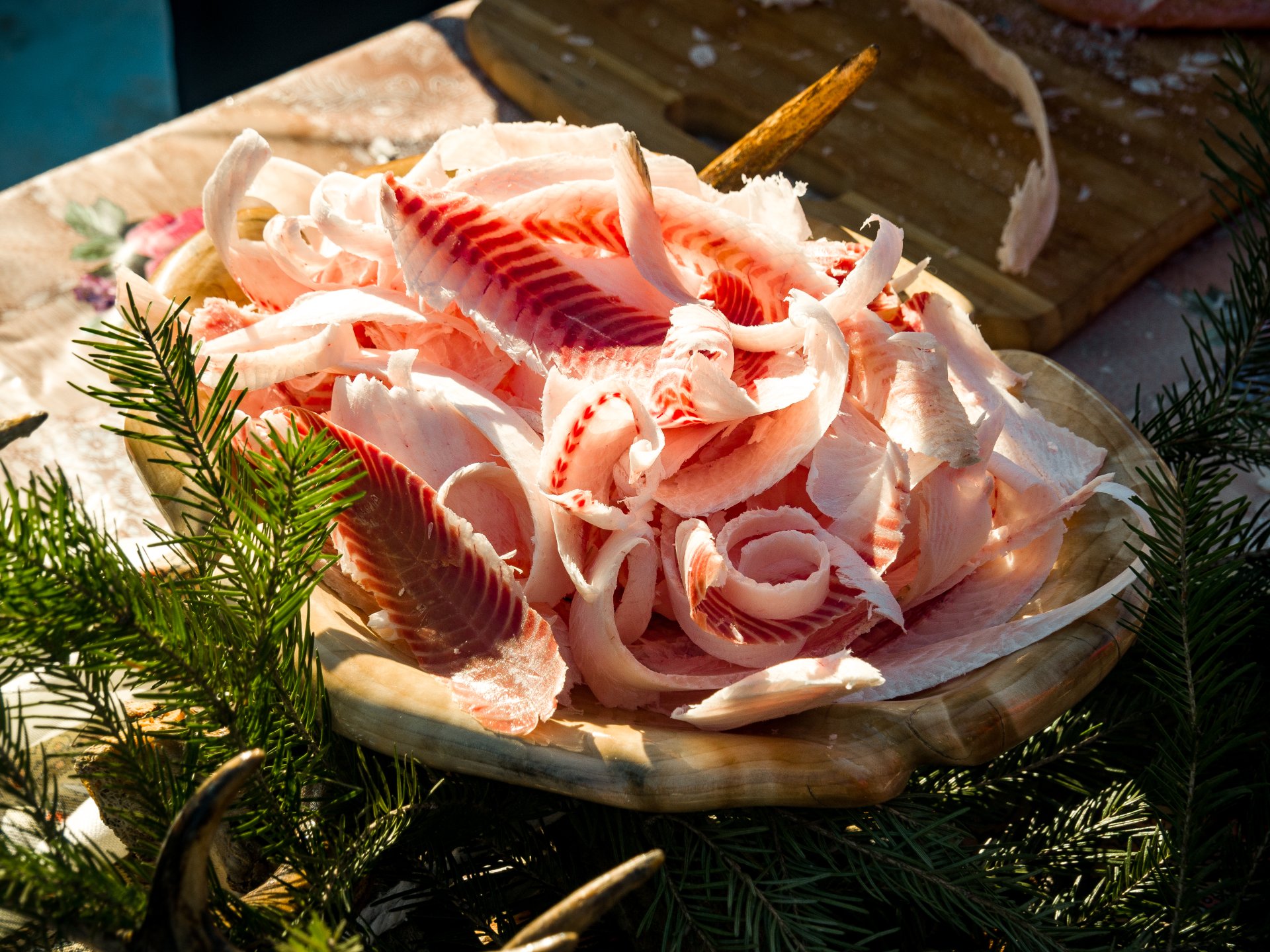 The winner of the competition is the one who slices the fish the thinnest and presents the dish beautifully.
