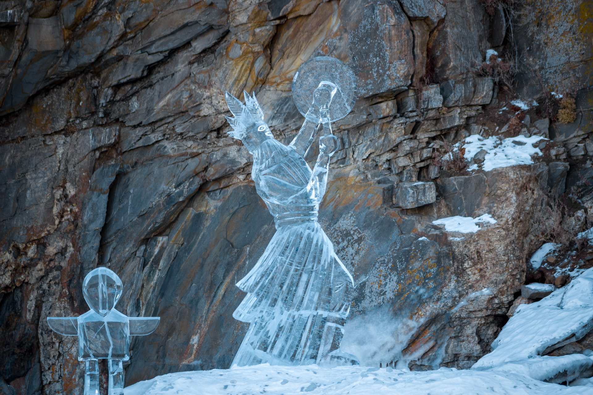 A shaman is also depicted here. Who knocks on a tambourine and a primitive man comes out of the cave after him.