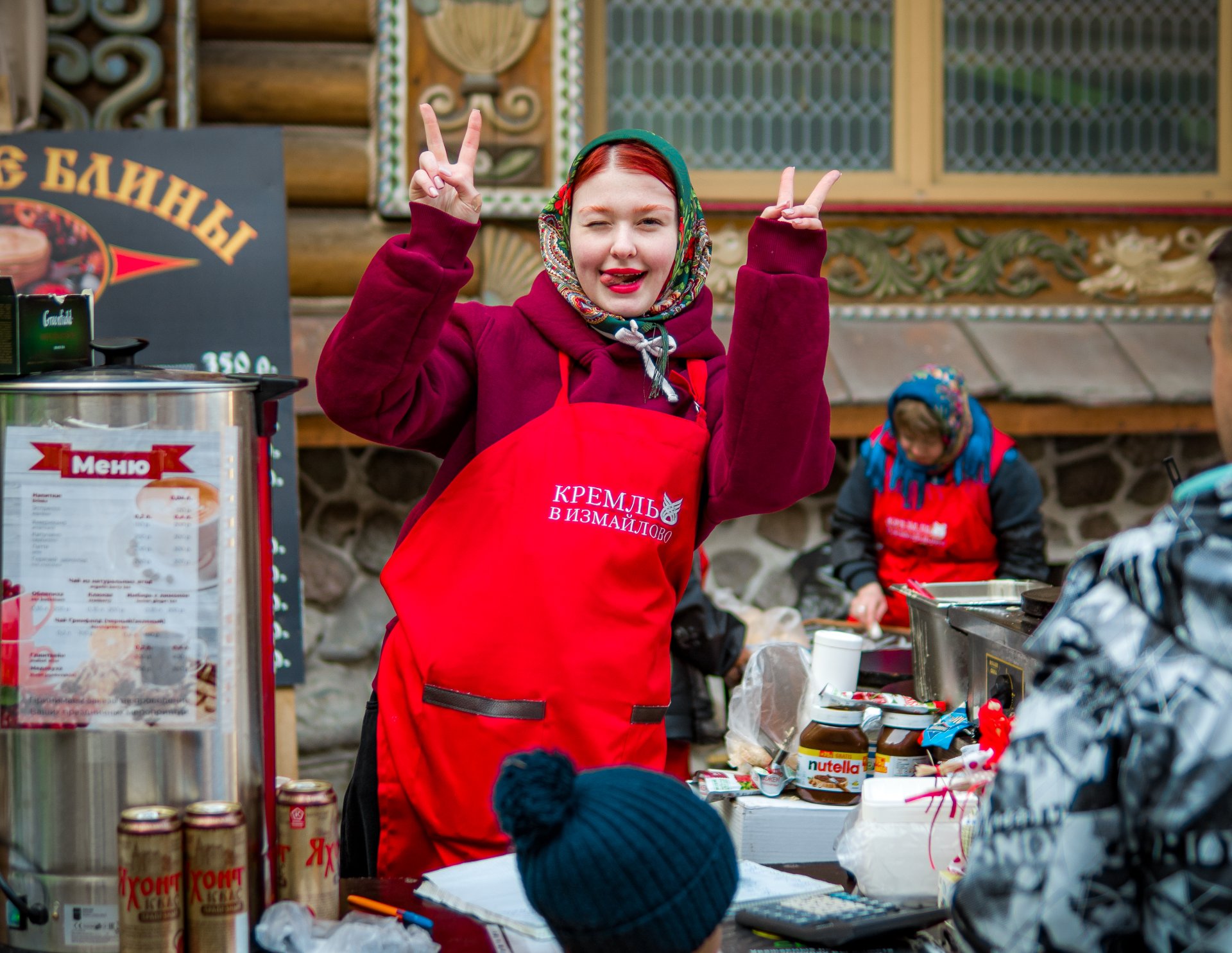 A young girl who treats the guests of the festival with tea.